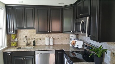 Upper Cabinets Extend to Ceiling for More Storage 