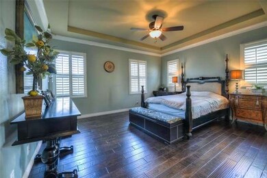 Huge Master with Beautiful Wood Floor and wood Shu