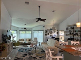 Living room with ceiling fan, hardwood / wood-styl