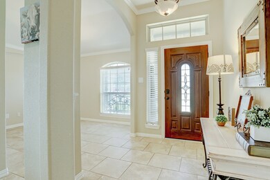 View of the front door and dining room