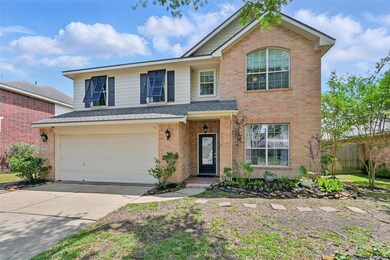 A charming covered front porch complemented by ele