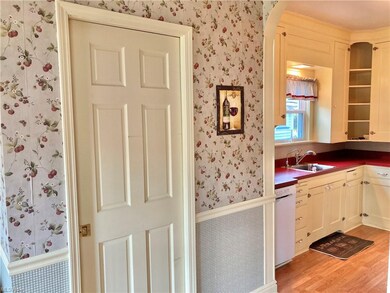 Powder room is Conveniently located behind pocket door ~