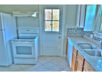Updated kitchen with granite countertops and door 