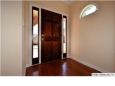 PRETTY LITTLE ARCHED WINDOW IN FOYER ALLOWS FOR A 