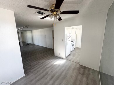 Unfurnished room with a textured ceiling, wood fin