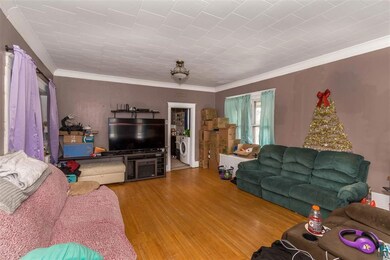 Living Room boasts beautiful hardwood floors and o