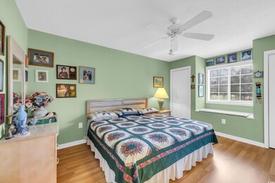 Bedroom featuring wood finished floors and ceiling fan