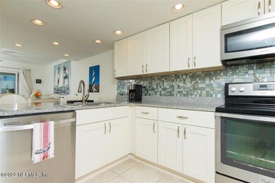 KITCHEN OVERLOOKS DINING AND LIVING ROOM