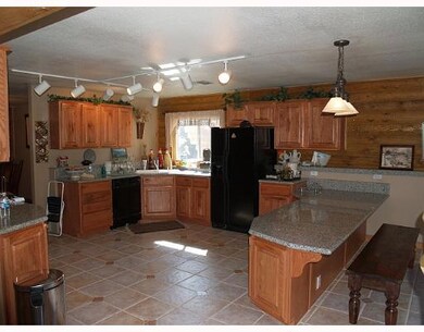 Kitchen. Inviting large, open kitchen with breakfa