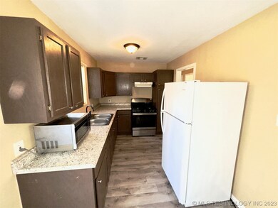 Updated kitchen cabinets, floor and appliances