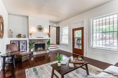 Living area with hardwood / wood-style floors and
