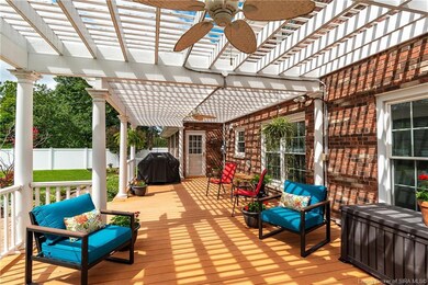 Sprawling composite deck with pegola above will ma