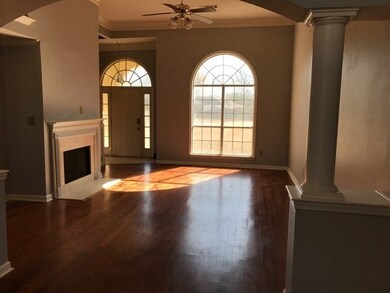 Den has 12 foot ceilings and wood floors! Lots of 