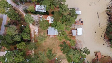 Aerial view of property…house is on one lot and th