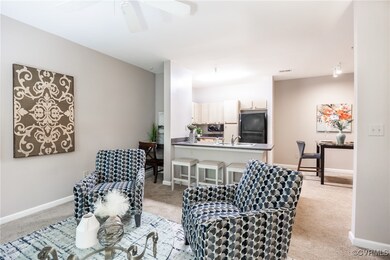 Living room with light colored carpet and ceiling