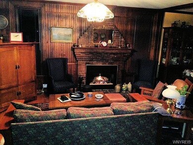 Living room with fireplace and lovely wainscoting