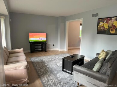 Living room with wood finished floors and baseboards