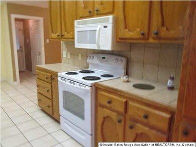 Another kitchen view with stove and microwave