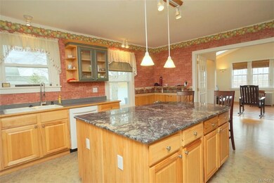 Kitchen --French doors  open to back sitting area 