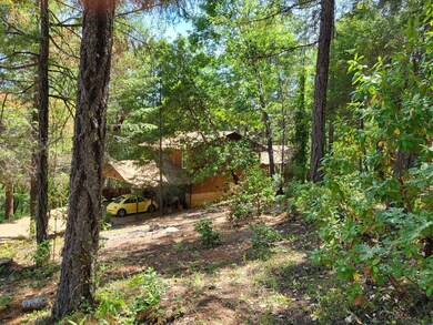 Back of house with carport
