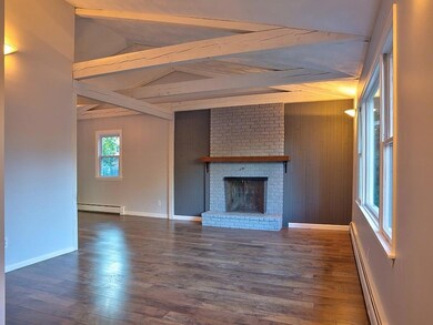 Living room with functioning fireplace