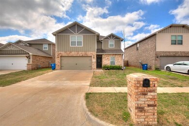 View of front of home with a front yard and two ca