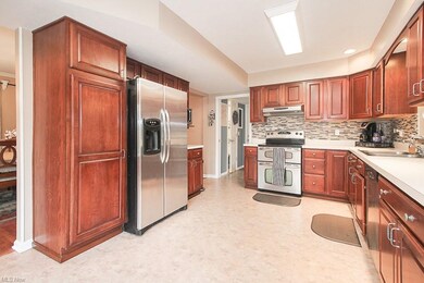 The kitchen has great cabinet space and a pantry.