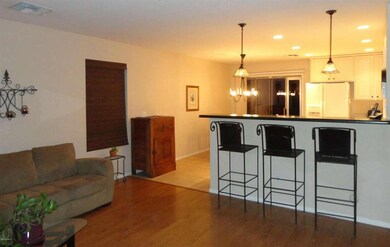Wood laminate floor in Family Room and L