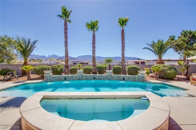 huge pool/spa is heated and features 8 waterfalls