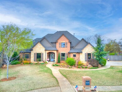 Craftsman-style house with stone siding, fence, a 