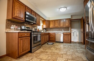 Beautiful, open kitchen with stainless appliance p