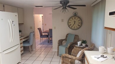 kitchen has a built in desk area.