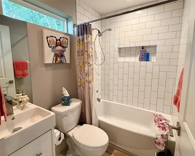 Bathroom with vanity and shower / tub combo with 
