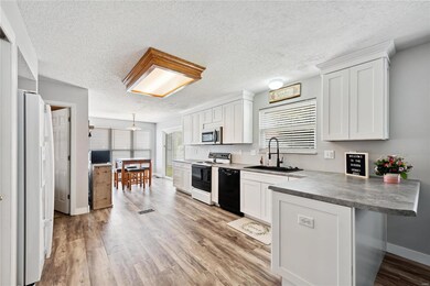 Eat in Kitchen with Newer White Cabinets with soft