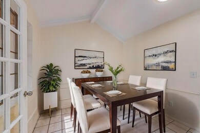 Dining space with light tile patterned flooring an