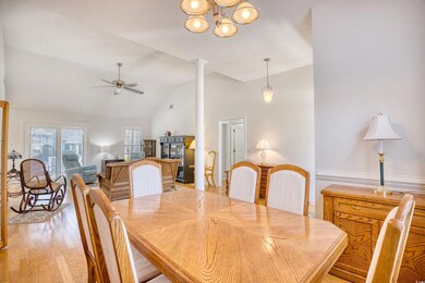 Dining room with lofted ceiling, a ceiling fan, li
