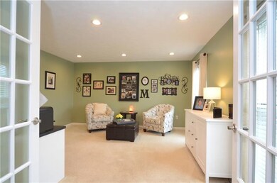 French doors lead into the large living room.