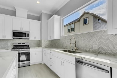 The kitchen boast with porcelain backsplash and st