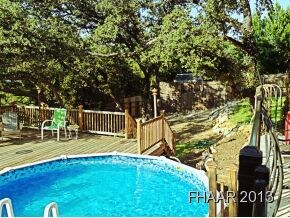 deck with pool and steps