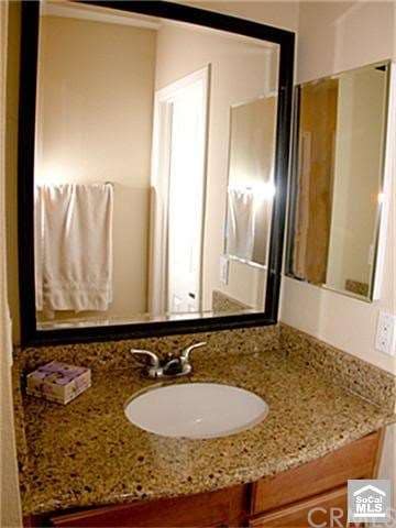 Separate sine and vanity features granite counter 