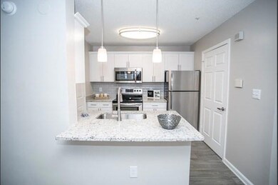 Kitchen with appliances with stainless steel finis