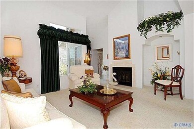 Another view of the living room and fireplace