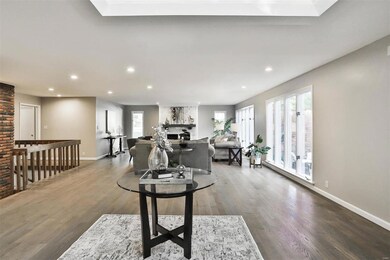 Foyer is open to the living room and features a large skylight.