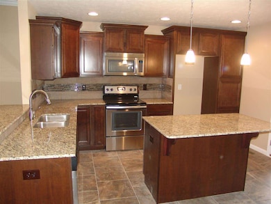 Upgraded cabinets, Island and Granite tops