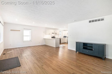The Living Room is light, bright and airy and opens to the Dining Area and Kitchen.