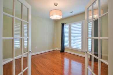 Front office with hardwood & french doors.