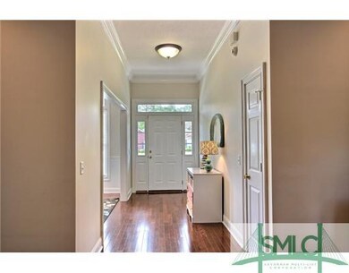Foyer. Welcoming foyer with wood floors and high c