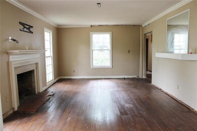 Living room is huge and has real wood flooring
