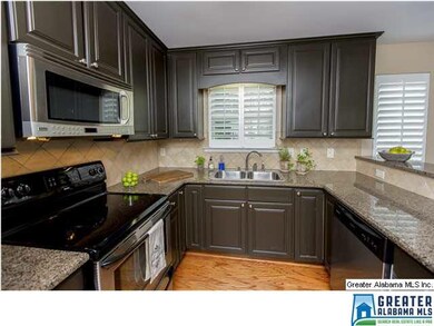 Updated Kitchen with Stainless Appliances and Gran