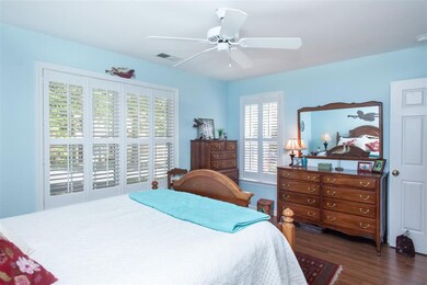 Large windows include plantation shutters.